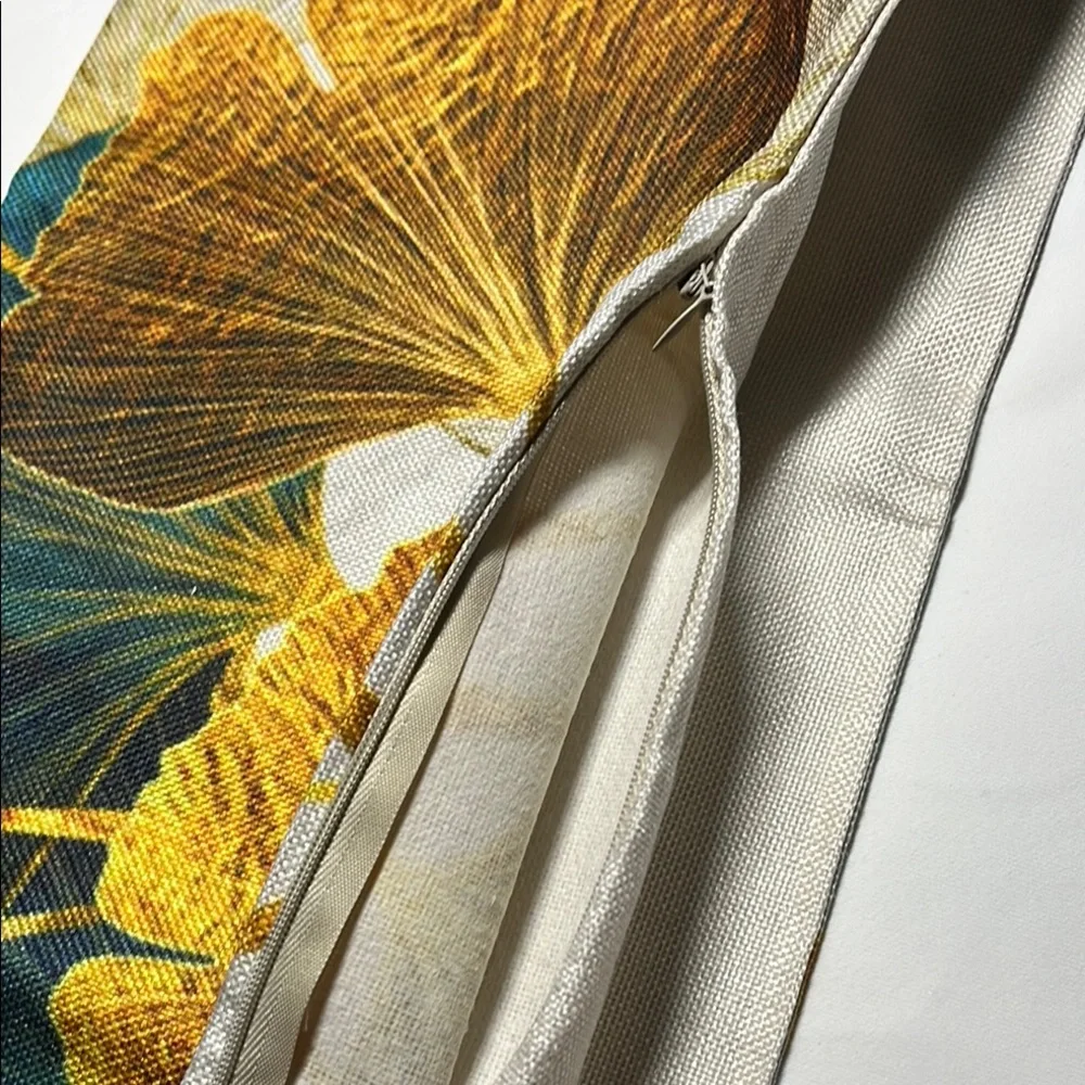 Floral Patterned outdoor waterproof throw pillow with Blue and Yellow Leaves.